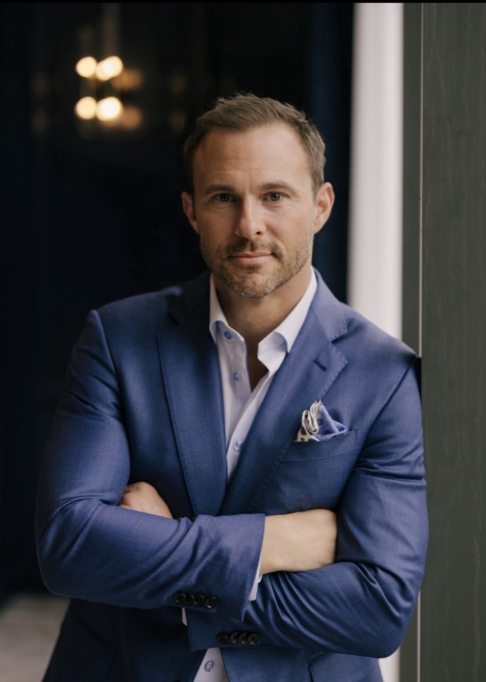 Josh Ellis, founder and CEO of ELLI, in a navy blazer